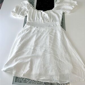 White mini dress,white ,with elastic in the back that fits perfectly